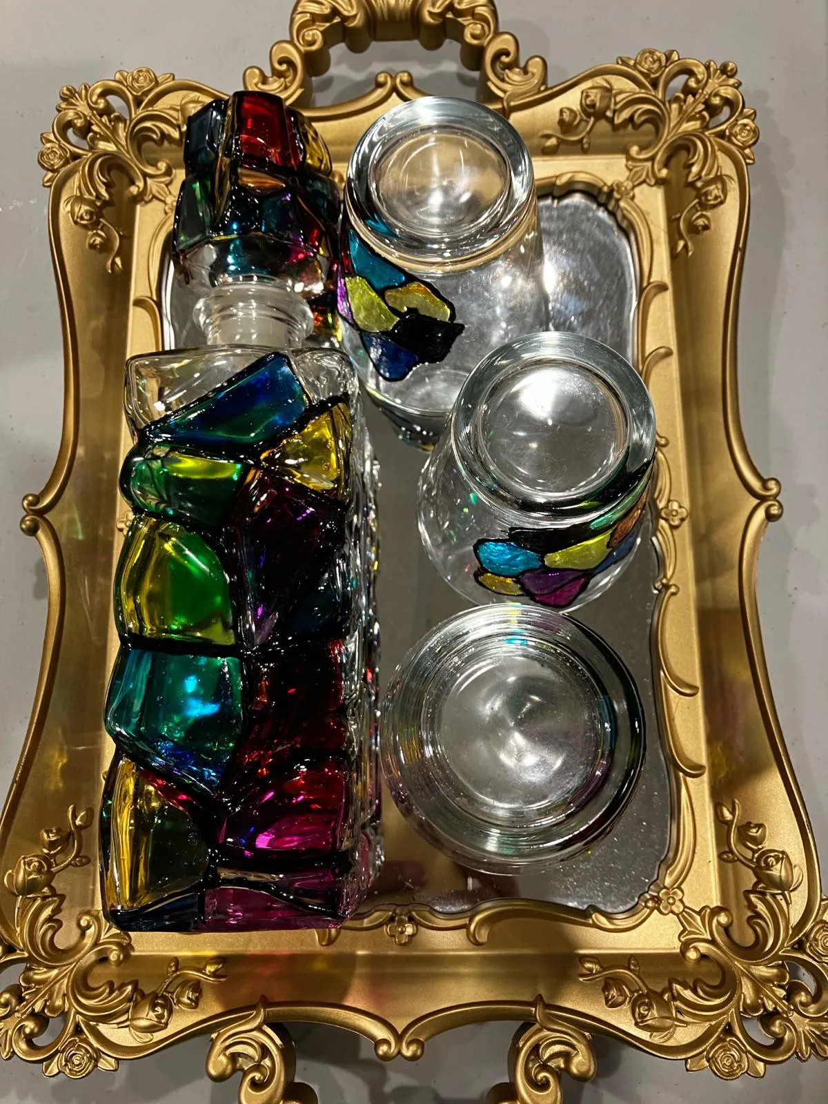 Stained glass painted bottle with 4 drinking glasses and golden tray