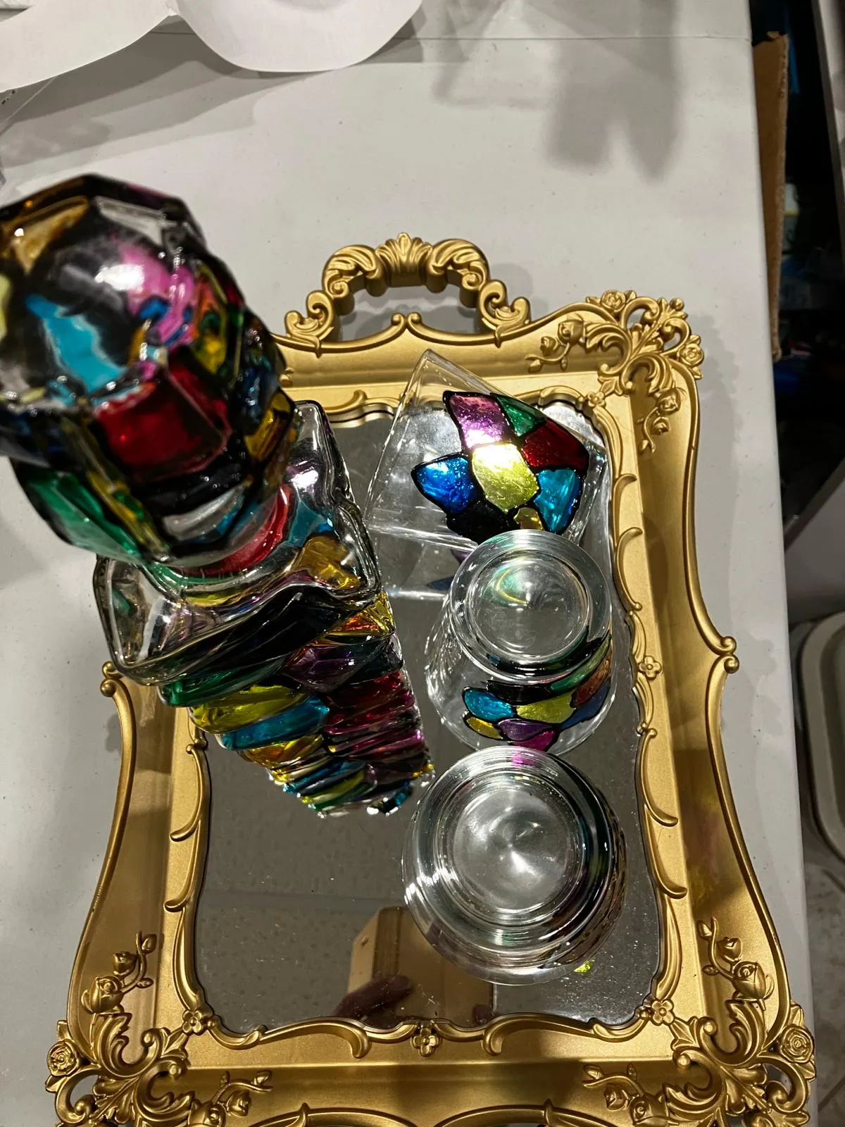 Stained glass painted bottle with 4 drinking glasses and golden tray